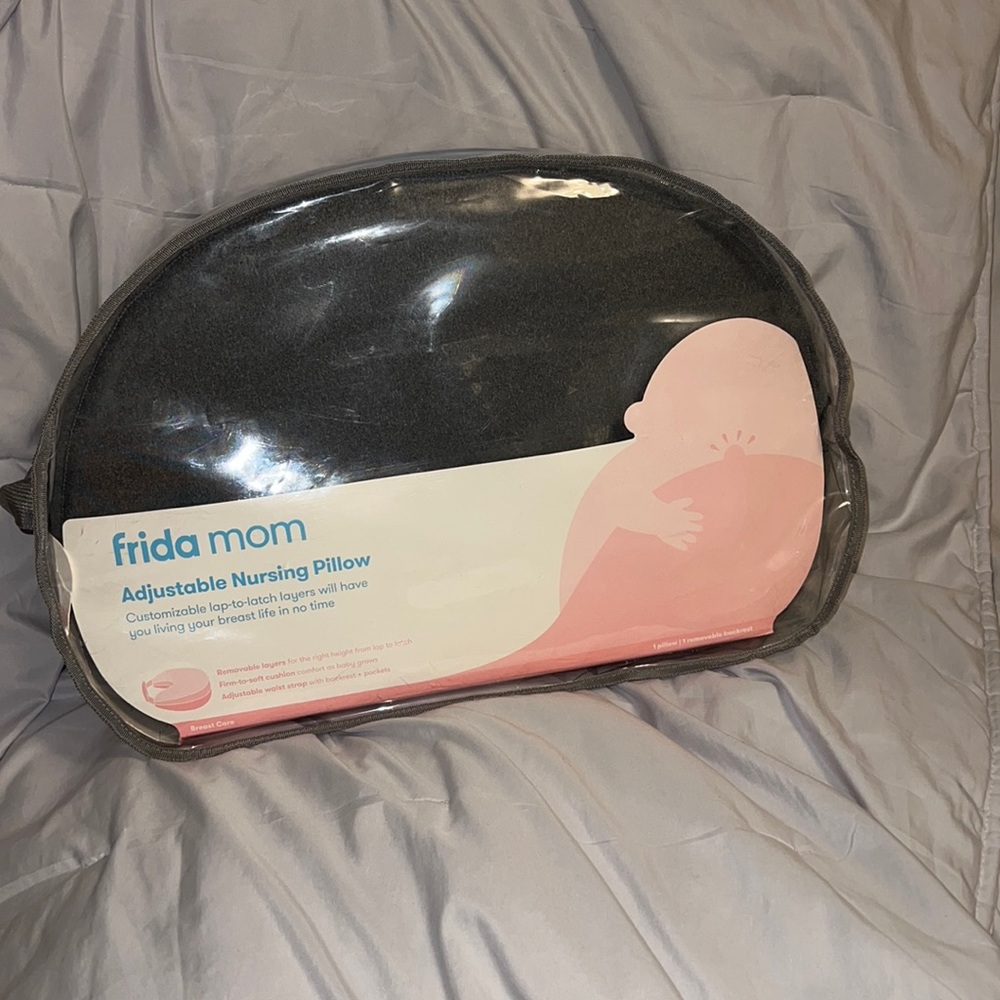 Brand new. Never opened.Frida mom adjustable nursing pillow